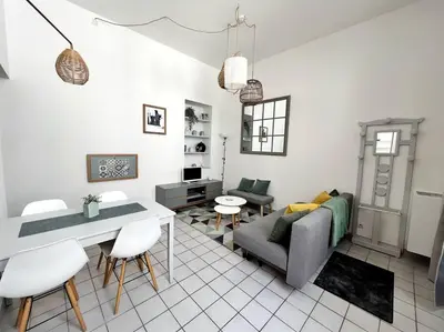 Coin salon dans l'établissement Cour Passy - Centre ville