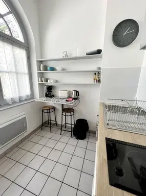 Cuisine ou kitchenette dans l'établissement Cour Passy - Centre ville
