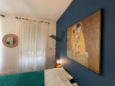 Un ou plusieurs lits dans un hébergement de l'établissement Cocon Bleu - Maison idéalement située avec jardin