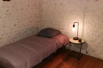 Un ou plusieurs lits dans un hébergement de l'établissement Maison charentaise à la campagne