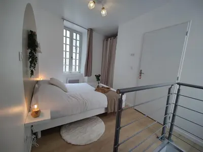 Un ou plusieurs lits dans un hébergement de l'établissement Le duplex de l'Abbaye Royale - Studio cosy !