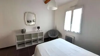 Un ou plusieurs lits dans un hébergement de l'établissement MAISON ROUGE LE PONANT