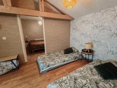 Un ou plusieurs lits dans un hébergement de l'établissement Jolie Maison au 34 centre-ville