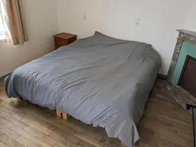 Un ou plusieurs lits dans un hébergement de l'établissement Appartement le Vigeant