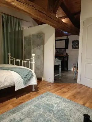 Un ou plusieurs lits dans un hébergement de l'établissement 'Quelle Belle Vue' Chambre d'Hote