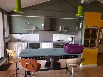 Cuisine ou kitchenette dans l'établissement COSA SARA