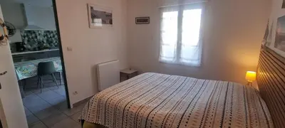 Un ou plusieurs lits dans un hébergement de l'établissement Les Sablines - Maisons T2 à 700m de l'océan - Terrasse et parking