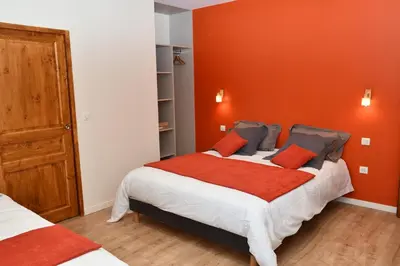 Un ou plusieurs lits dans un hébergement de l'établissement Grande maison de vacances Les Reinettes
