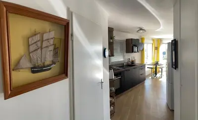 Cuisine ou kitchenette dans l'établissement Le Lodge Park à La Rochelle