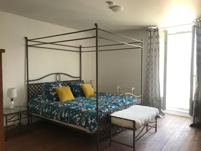 Un ou plusieurs lits dans un hébergement de l'établissement Le Petit Maison