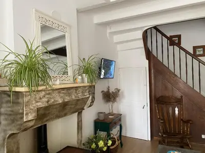 Télévision ou salle de divertissement dans l'établissement Le Petit Maison