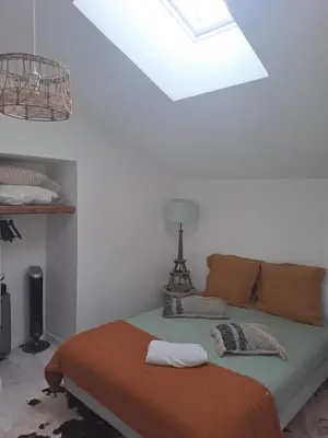 Un ou plusieurs lits dans un hébergement de l'établissement Maison dépaysante au calme Soyaux Angoulême