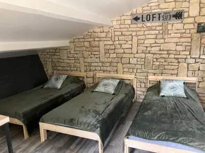 Un ou plusieurs lits dans un hébergement de l'établissement Charmant petit dortoir 3 places