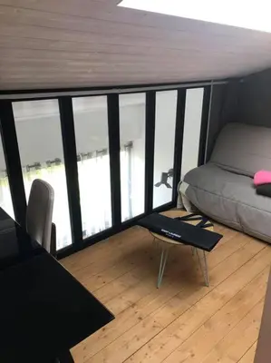 Coin salon dans l'établissement APPARTEMENT CENTRE VILLE AU CALME JARDIN et PARKING PUBLIC
