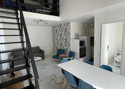 Cuisine ou kitchenette dans l'établissement Appartement vue sur la Charente