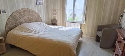 Un ou plusieurs lits dans un hébergement de l'établissement Charmante maisonnette proche plage