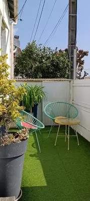 Jardin de l'établissement Charmante maisonnette proche plage