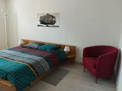 Un ou plusieurs lits dans un hébergement de l'établissement Charmante maison à Corme-Royal