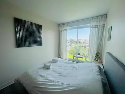 Un ou plusieurs lits dans un hébergement de l'établissement Le Rétro - Splendide appartement