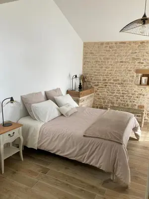 Un ou plusieurs lits dans un hébergement de l'établissement Chambre d’hôtes de la Source