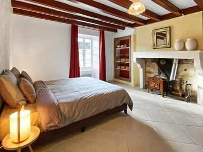 Un ou plusieurs lits dans un hébergement de l'établissement L'ancien Cafe - Suites and Gites