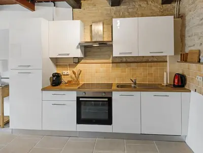 Cuisine ou kitchenette dans l'établissement L'ancien Cafe - Suites and Gites