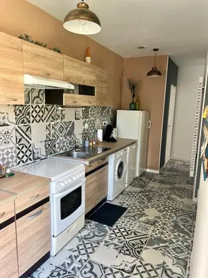 Cuisine ou kitchenette dans l'établissement L'écolier futuroscope 4 personnes