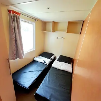 Un ou plusieurs lits dans un hébergement de l'établissement Camping Margot