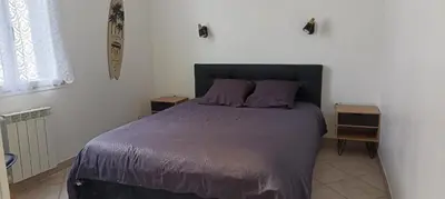 Un ou plusieurs lits dans un hébergement de l'établissement Maison de vacances en plein cœur de Châtelaillon-Plage