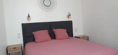Un ou plusieurs lits dans un hébergement de l'établissement Maison de vacances en plein cœur de Châtelaillon-Plage