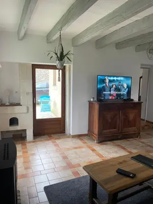 Télévision ou salle de divertissement dans l'établissement Gîte de charme La Pocterie