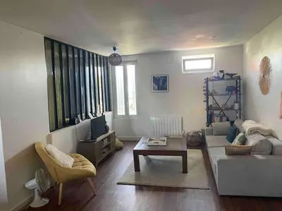 Coin salon dans l'établissement Appartement chaleureux au cœur de la ville