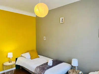 Un ou plusieurs lits dans un hébergement de l'établissement Le Cottage - Jolie Maison à Buxerolles