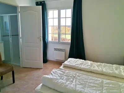 Un ou plusieurs lits dans un hébergement de l'établissement Villa with garden near beautiful golf course