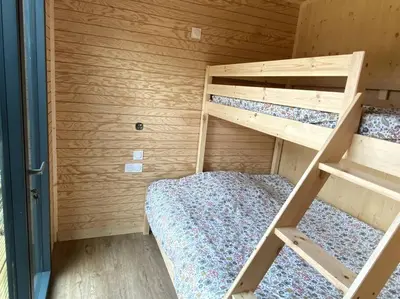 Un ou plusieurs lits dans un hébergement de l'établissement La Cabane du Petit Moulin