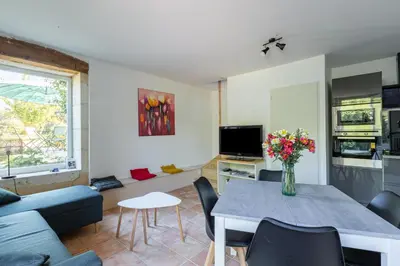 Télévision ou salle de divertissement dans l'établissement Gîte LuluDine