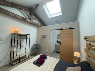 Un ou plusieurs lits dans un hébergement de l'établissement Maison Les Iris - 3 chambres et 3 salles de bain - 3 à 6 personnes - Futuroscope