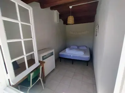 Un ou plusieurs lits dans un hébergement de l'établissement La Portbarquaise - maison front de mer