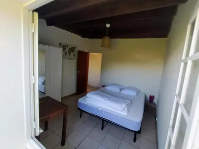 Un ou plusieurs lits dans un hébergement de l'établissement La Portbarquaise - maison front de mer