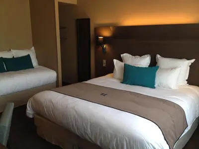 Un ou plusieurs lits dans un hébergement de l'établissement Moka Hotel