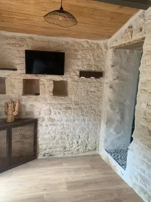 Télévision ou salle de divertissement dans l'établissement Le petit lodge cosy