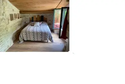 Un ou plusieurs lits dans un hébergement de l'établissement Le petit lodge cosy