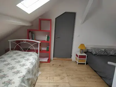 Un ou plusieurs lits dans un hébergement de l'établissement le loft de la place du marché