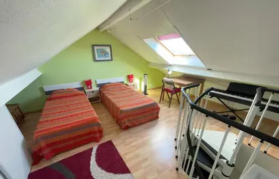 Un ou plusieurs lits dans un hébergement de l'établissement Maison de plage