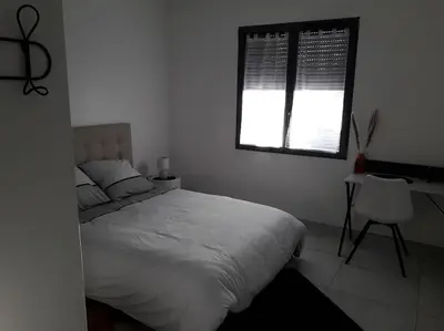 Un ou plusieurs lits dans un hébergement de l'établissement Maison neuve de standing 150 m2