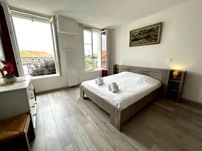 Un ou plusieurs lits dans un hébergement de l'établissement Le République - Logements avec jardin situés en plein cœur de ville et proche des thermes