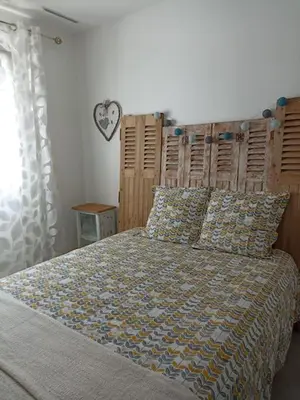 Un ou plusieurs lits dans un hébergement de l'établissement Maison d'hôtes cosy & agréable à 5min du Futuroscope
