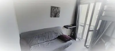 Un ou plusieurs lits dans un hébergement de l'établissement Cosy confort appart Cognac