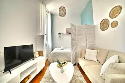 Télévision ou salle de divertissement dans l'établissement Le Petit Vauban - Beach and center