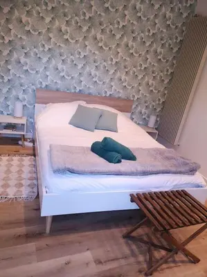 Un ou plusieurs lits dans un hébergement de l'établissement Studio neuf - accès SPA, SAUNA et Piscine Chauffée